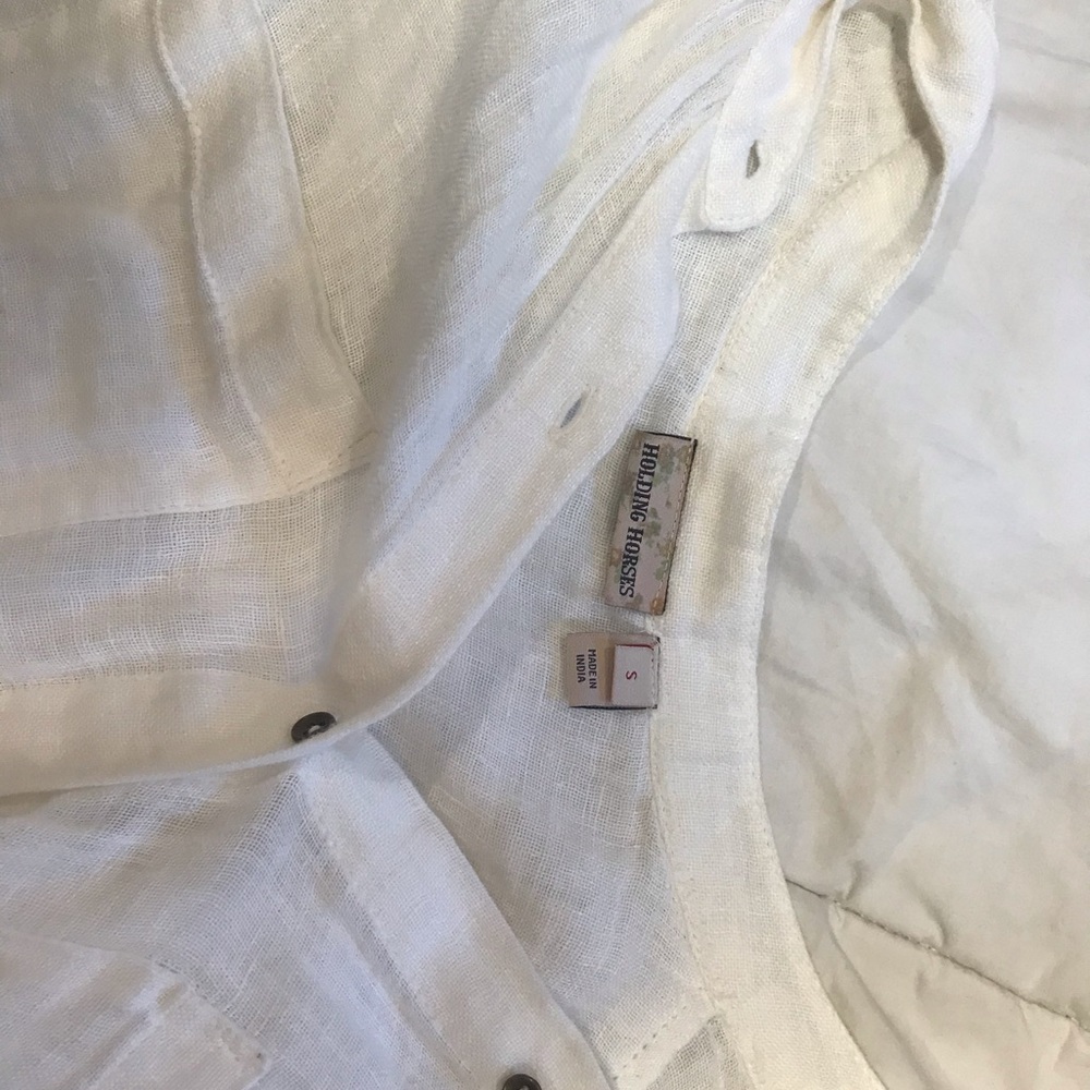 Holding horses tunic top
